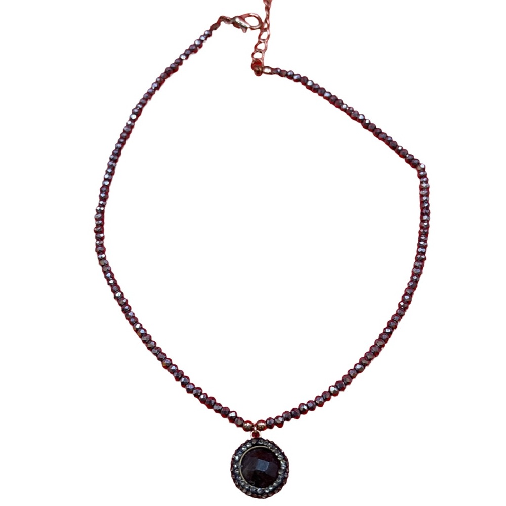Elegant Black Stone surrounded by crystals on a iridescent beaded chain.